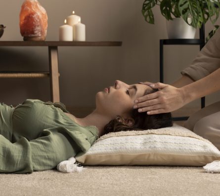 person-conducting-reiki-therapy