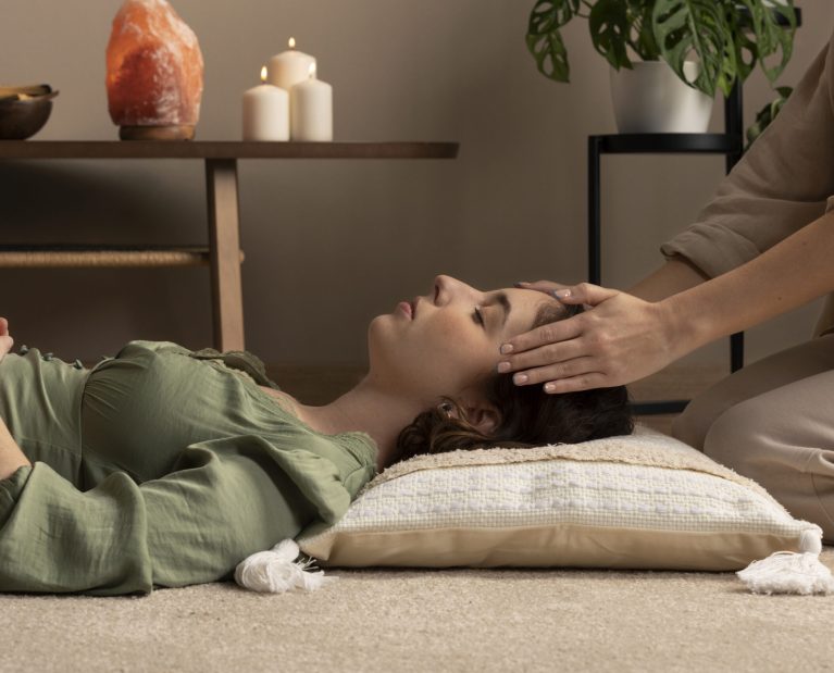 person-conducting-reiki-therapy